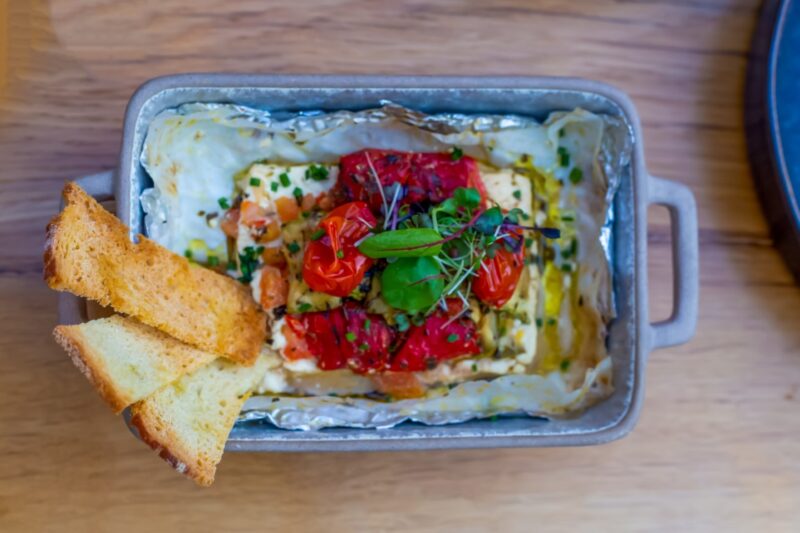 Lahanodolmas with rich egg-lemon cream, charred cabbage, crispy kale chips and dill oil
